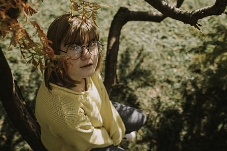 woman sitting on tree thumbnail