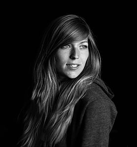 grayscale photo of woman wearing coat thumbnail