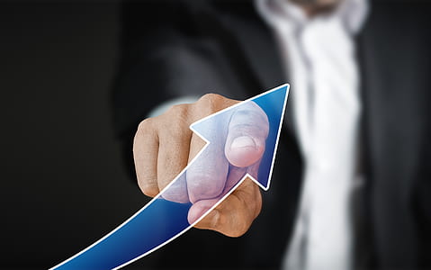 person pointing at blue arrow thumbnail