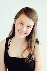 woman in black tank top smiling thumbnail