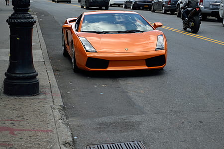 orange Lamborghini Gallardo on road thumbnail