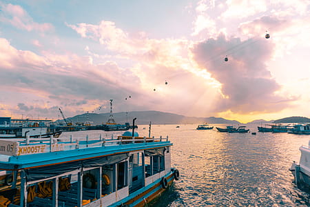 White and Blue Boat on Body of Water thumbnail