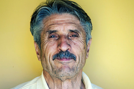 man wearing yellow polo shirt thumbnail