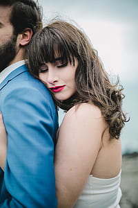 woman hugging man from back during daytime thumbnail
