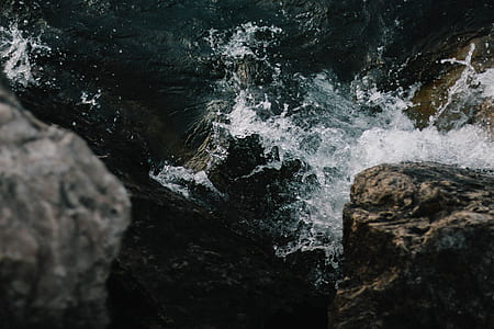 water waves splashed on rock formation thumbnail