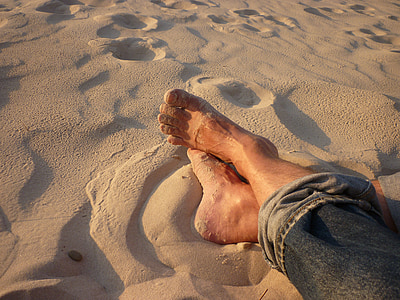 barefoot person wearing gray denim jeans thumbnail
