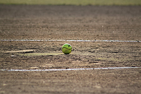 green baseball in the middle of ground thumbnail