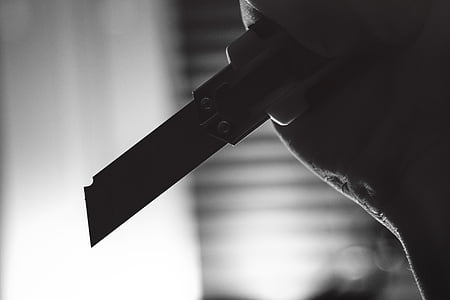 person holding utility knife thumbnail