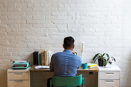 man sitting in front of desk thumbnail