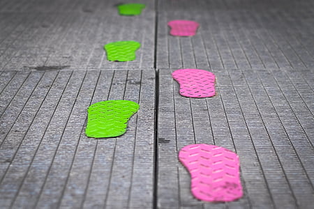 selective focus photography of green and pink footprints thumbnail