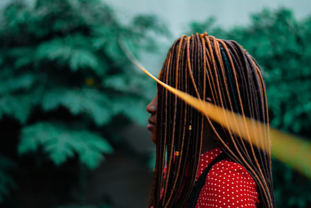 woman facing right side near tree during daytime thumbnail