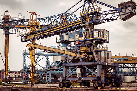 two yellow construction cranes thumbnail