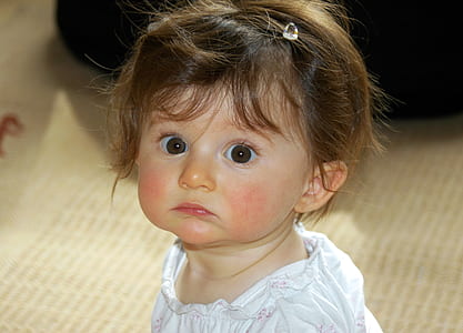 child wearing white floral top thumbnail
