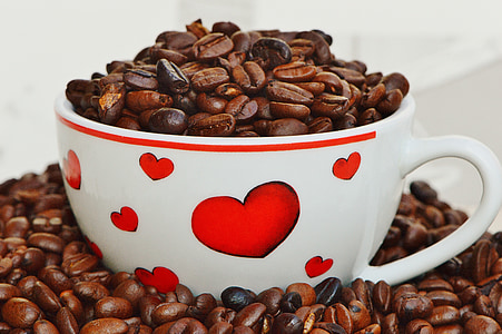 white ceramic cup filled with coffee beans thumbnail