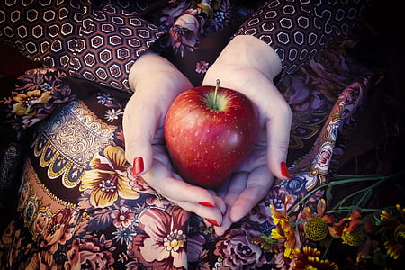 person holding red apple fruit thumbnail