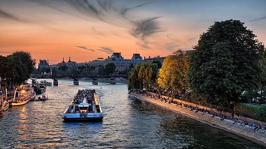 punt boat on river near building and trees during golden hour thumbnail