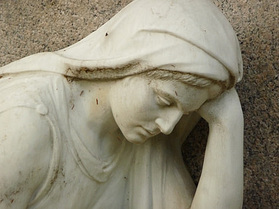 woman leaning on left hand statue thumbnail
