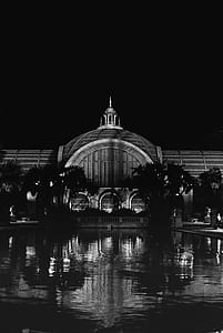 grayscale photo of building with fountain outside thumbnail