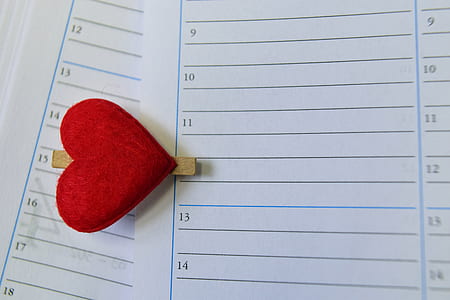 white printer paper beside red heart decor thumbnail