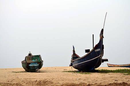 Rusty boats lying on the sand thumbnail