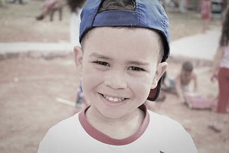 boy smiling wearing cap thumbnail