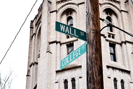Wall and College street signage near brown building in low angle photography thumbnail