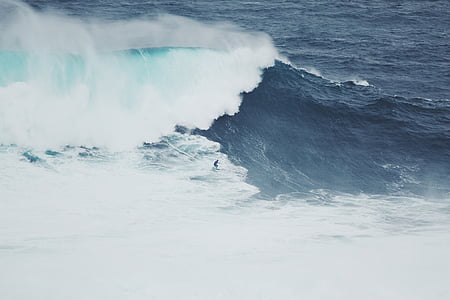 man riding surfboard during daytime thumbnail