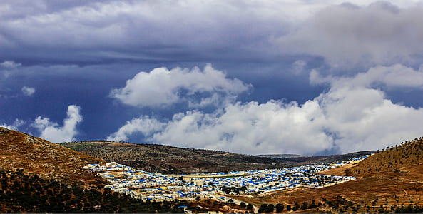 Aerial Photo of Mountain and City thumbnail