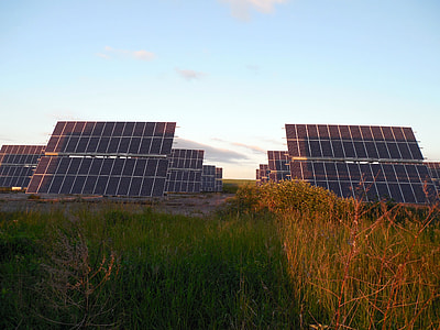 several solar panels near grass thumbnail