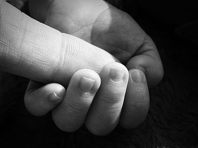 human finger on left palm thumbnail