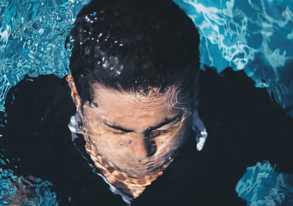 man in body of water thumbnail