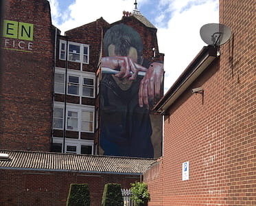 Giant mural on the side of an office conversion in New Cross, Manchester. thumbnail