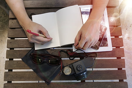 person writing on notebook thumbnail