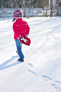 boy wearing blue jeans and walking in sno thumbnail