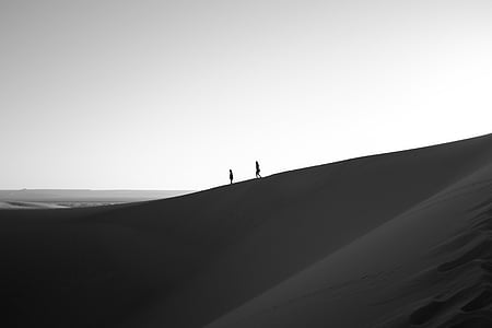two person walking on desert silhouette thumbnail