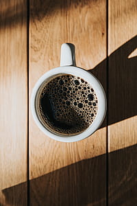white ceramic coffee mug filled with coffee thumbnail