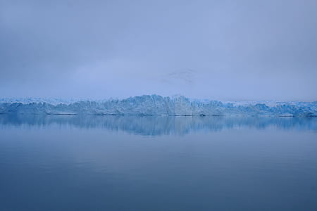 iceberg near body of water thumbnail