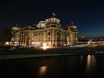 brown museum beside body of water thumbnail