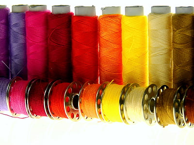 assorted-color threads with spools thumbnail