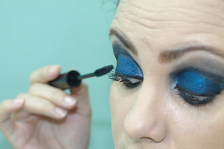 woman holding mascara thumbnail