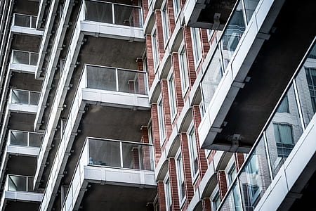 architectural photography of gray and red concrete building thumbnail