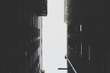 low-light and worm's-eye view photo of high rise building thumbnail