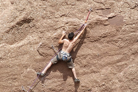 topless man climbing wall thumbnail