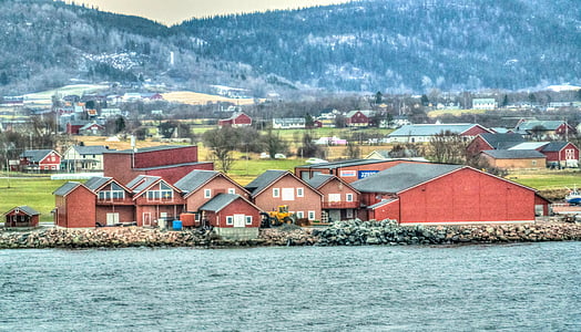 architectural photography of houses near body of water thumbnail