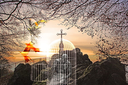white birdcage with cross on mountain thumbnail