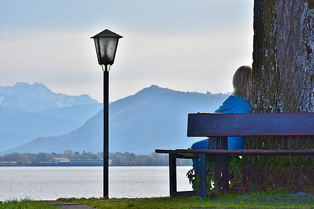 woman in blue top sitting on bench thumbnail