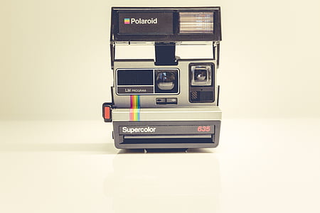 white and black Polaroid camera thumbnail