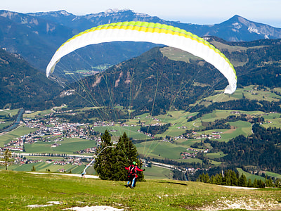man doing paragliding on mountain thumbnail