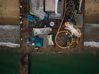 aerial view of amusement park on beach during daytime thumbnail