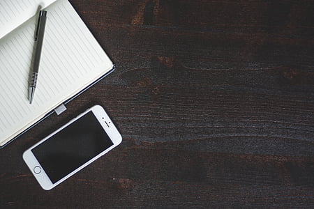 turned-off silver iPhone 6 near notebook thumbnail